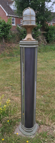 Tall prototype boolard exterior with brass light