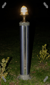 Tall boolard lit up at night